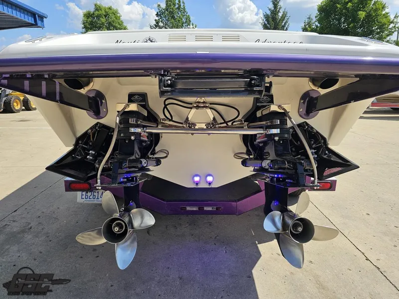 Slide: The Image of Rear view of 2003 Sunsation 32 Dominator boat with dual propellers and sleek design. - 30