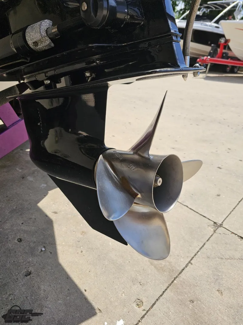 Slide: The Image of Close-up of a 2003 Sunsation 32 Dominator boat propeller on a concrete surface. - 37