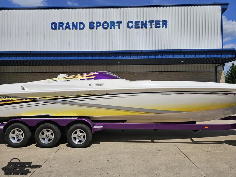 Slide: The Image of 2003 Sunsation 32 Dominator boat on trailer at Grand Sport Center. - 4