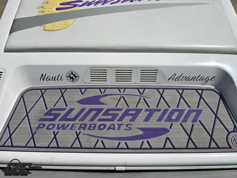 Slide: The Image of 2003 Sunsation 32 Dominator powerboat with "Nauti Advantage" branding and logo. - 40