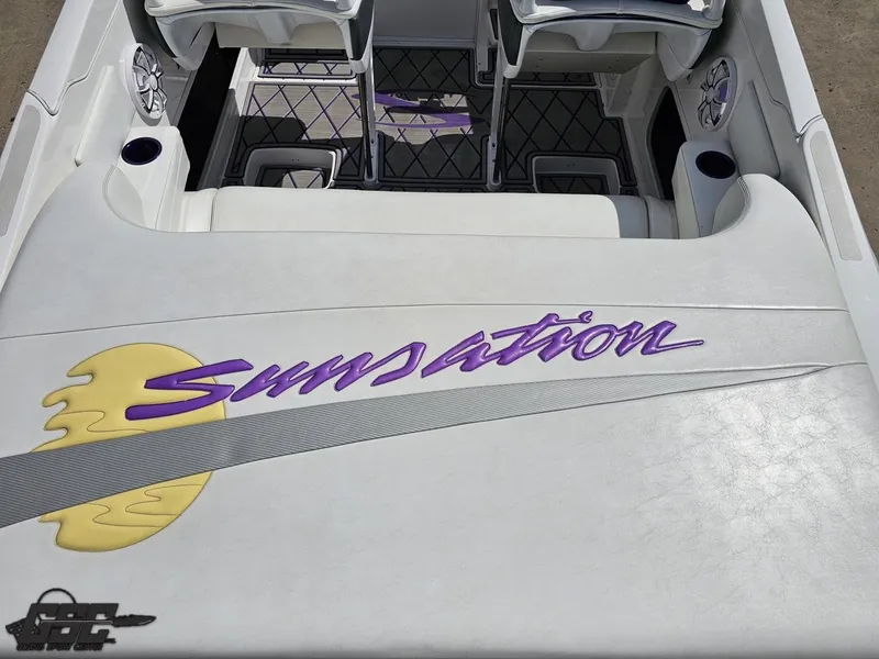 Slide: The Image of 2003 Sunsation 32 Dominator boat interior with logo and seating area. - 42
