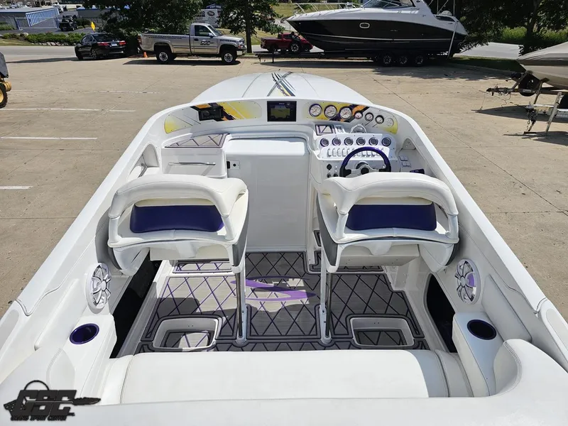 Slide: The Image of 2003 Sunsation 32 Dominator boat interior with dual seats and control panel. - 45