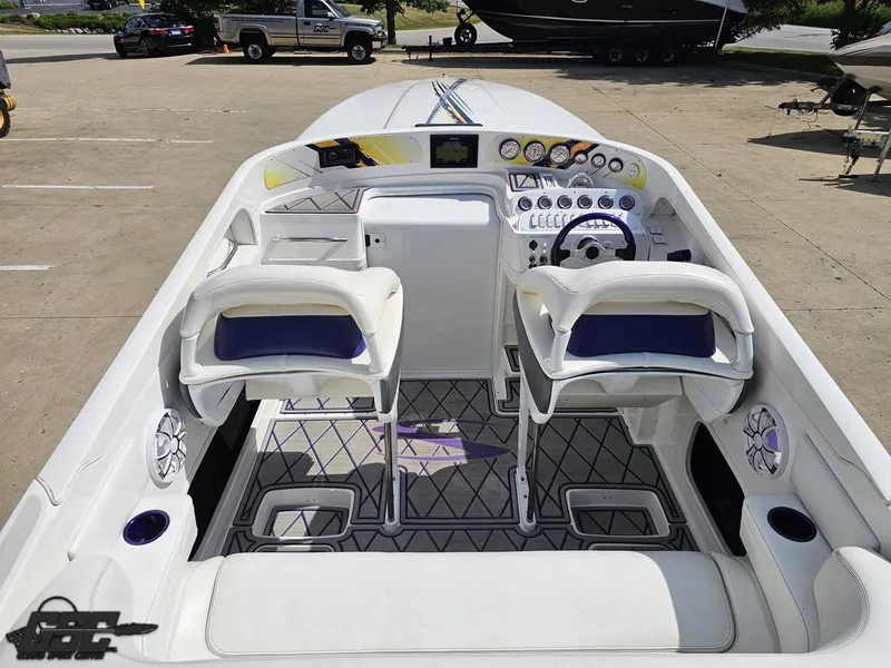 Slide: The Image of 2003 Sunsation 32 Dominator boat interior with dual seats and control panel. - 46