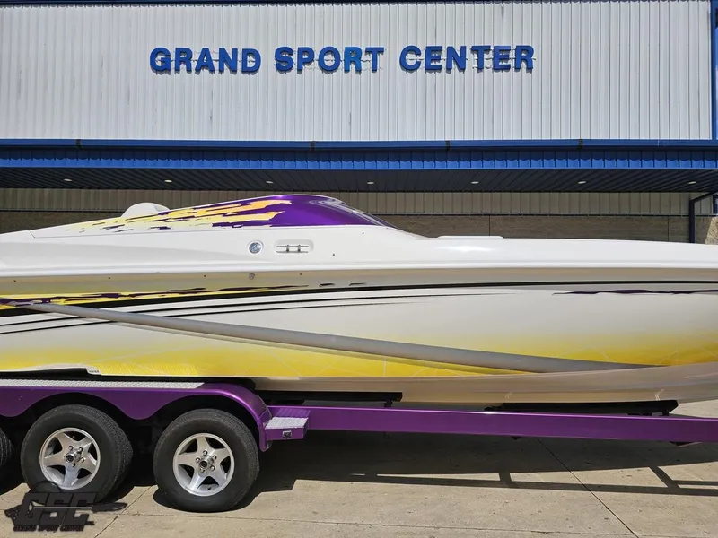 Slide: The Image of 2003 Sunsation 32 Dominator boat on trailer at Grand Sport Center. - 5