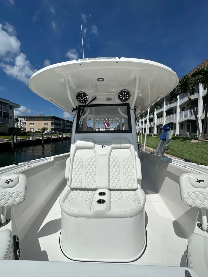 Slide: The Image of 2022 Sea Pro 320 DLX Center Console boat with luxurious seating and modern design. - 10