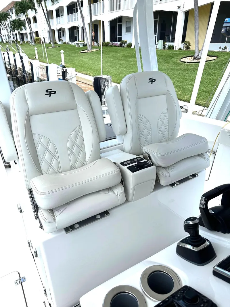 Slide: The Image of 2022 Sea Pro 320 DLX Center Console with luxurious seating and modern controls. - 11
