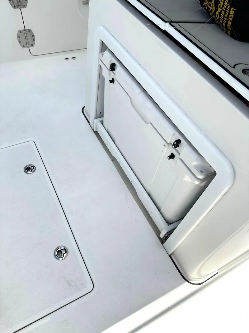 Slide: The Image of 2022 Sea Pro 320 DLX Center Console boat interior storage compartment. - 14