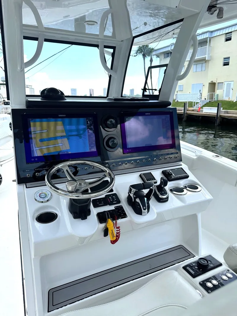 Slide: The Image of 2022 Sea Pro 320 DLX Center Console with advanced navigation and control systems. - 25