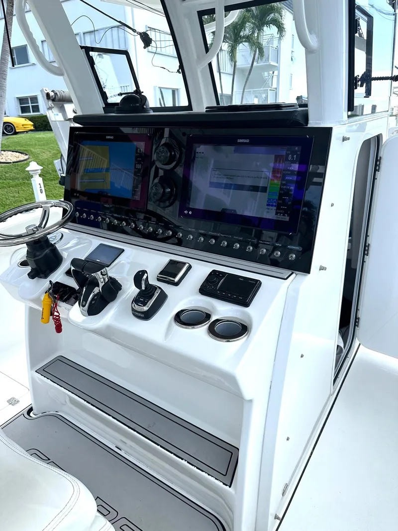 Slide: The Image of 2022 Sea Pro 320 DLX Center Console with advanced navigation and control systems. - 26