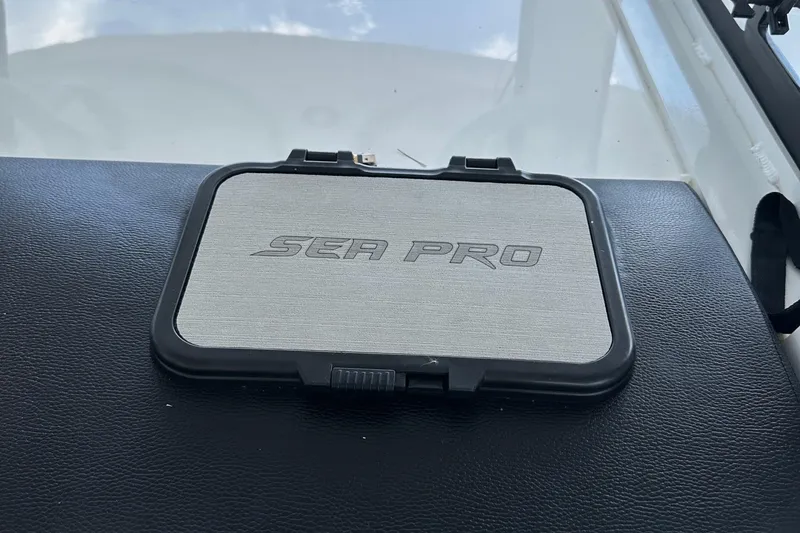 Slide: The Image of 2022 Sea Pro 320 DLX Center Console logo on dashboard. - 31