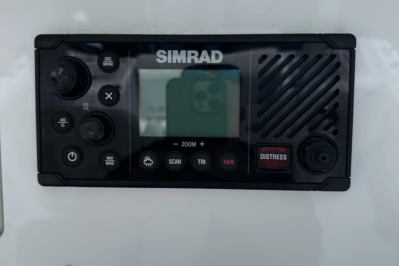 Slide: The Image of Simrad marine radio on 2022 Sea Pro 320 DLX Center Console boat dashboard. - 32
