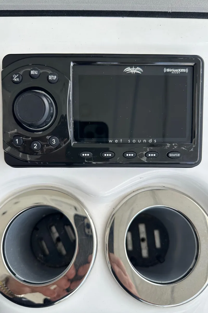 Slide: The Image of 2022 Sea Pro 320 DLX Center Console stereo system with dual cup holders. - 37
