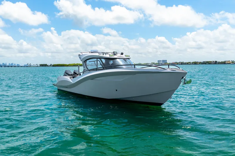 Slide: The Image of Luxury Novielli SERE 2025 boat cruising on clear blue water under a sunny sky. - 10