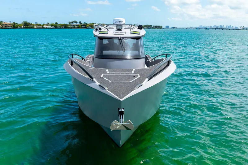 Slide: The Image of Front view of a 2025 Novielli SERE boat on clear blue water. - 11