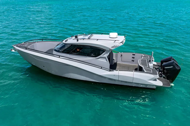 Slide: The Image of 2025 Novielli SERE boat on turquoise water, showcasing sleek design and modern features. - 12