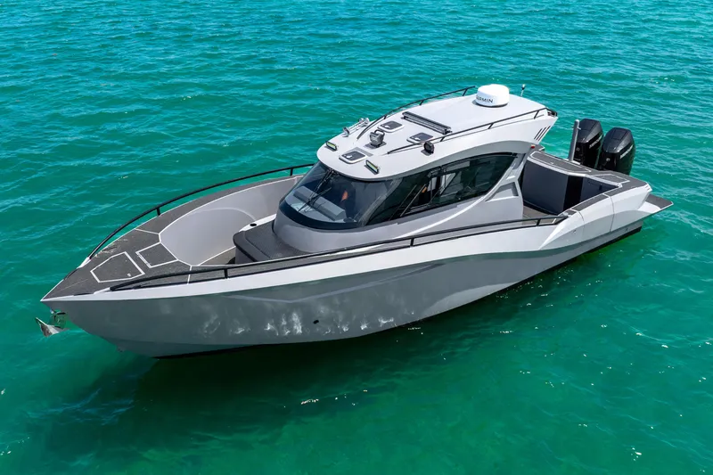 Slide: The Image of 2025 Novielli SERE boat on clear blue water, showcasing sleek design and modern features. - 13