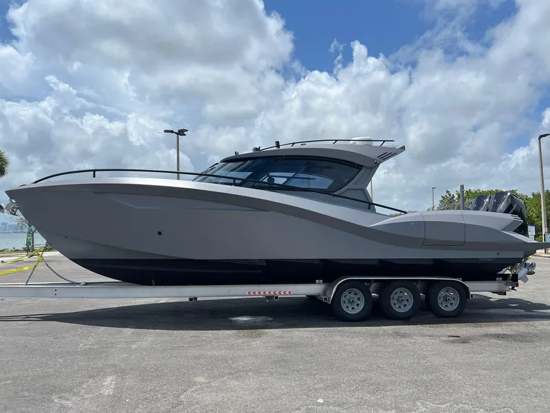 Slide: The Image of 2025 Novielli SERE boat on trailer under cloudy sky. - 14