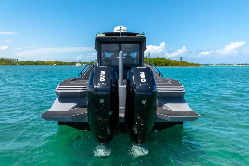 Slide: The Image of Novielli SERE 2025 boat with dual Mercury V10 engines on clear blue water. - 6