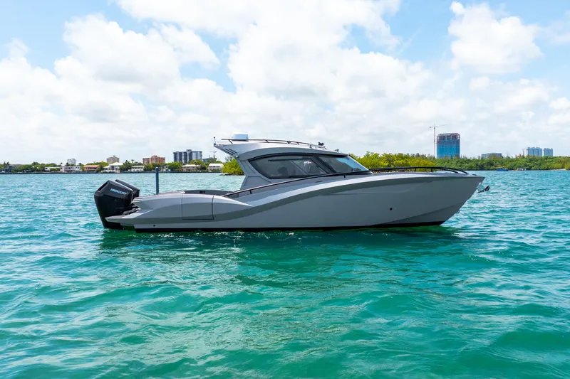 Slide: The Image of Sleek 2025 Novielli SERE boat on turquoise water under a bright sky. - 8