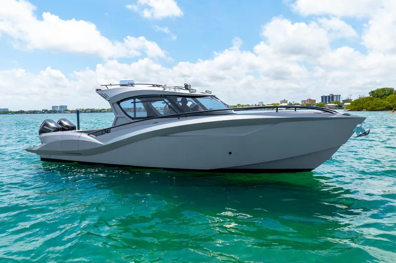 Slide: The Image of 2025 Novielli SERE boat on clear blue water under a partly cloudy sky. - 9