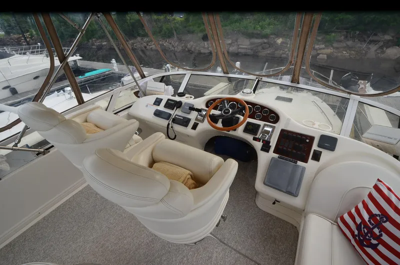 Slide: The Image of Interior of 2000 Sea Ray 420 Aft Cabin yacht with helm and seating area. - 10