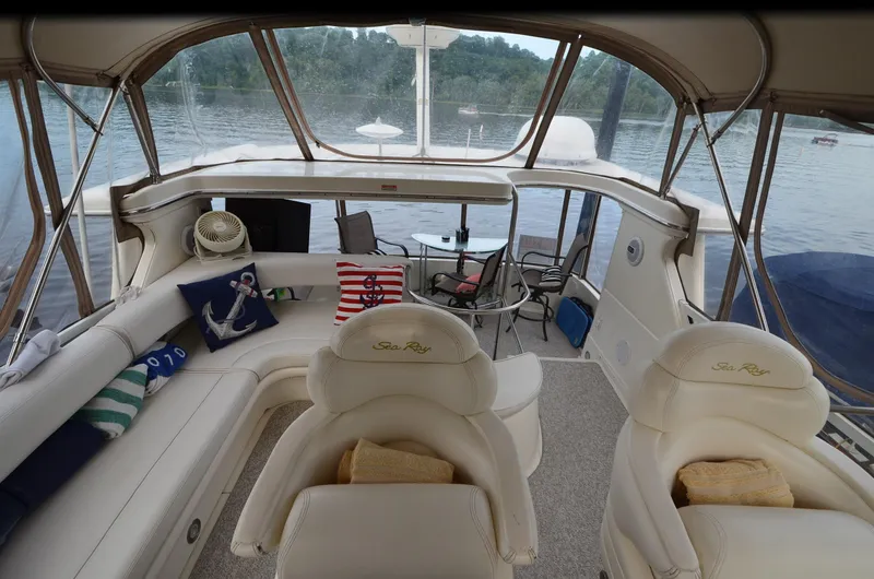 Slide: The Image of Interior of 2000 Sea Ray 420 Aft Cabin yacht with comfortable seating and lake view. - 14