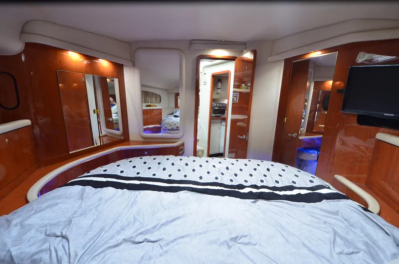 Slide: The Image of Luxurious bedroom interior of 2000 Sea Ray 420 Aft Cabin yacht. - 17