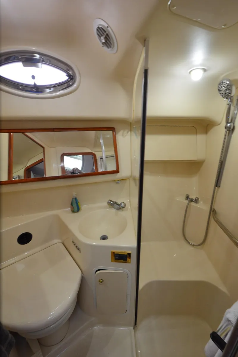 Slide: The Image of Bathroom interior of 2000 Sea Ray 420 Aft Cabin yacht, featuring shower and sink. - 20