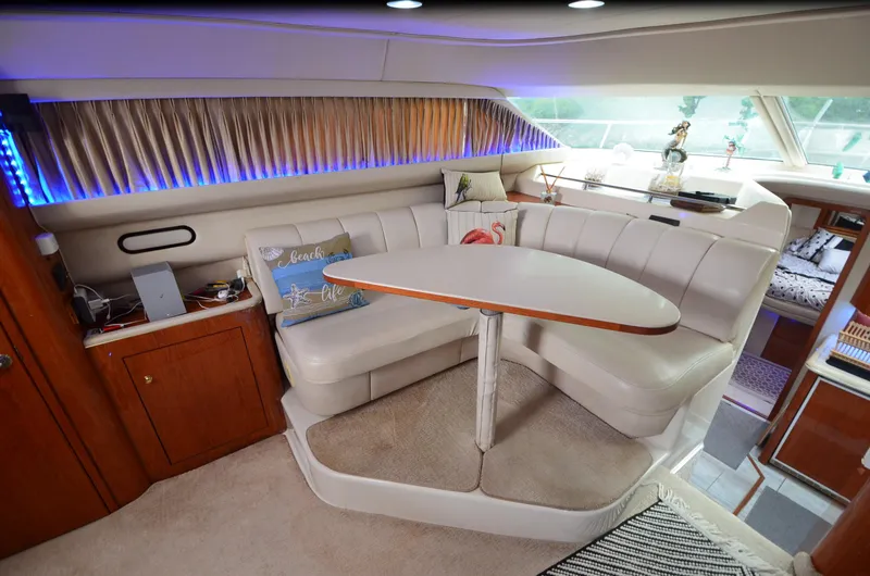 Slide: The Image of Luxurious interior of 2000 Sea Ray 420 Aft Cabin yacht with plush seating and elegant decor. - 22