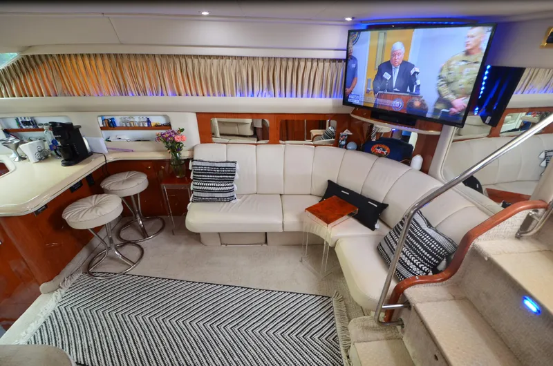 Slide: The Image of Luxurious interior of 2000 Sea Ray 420 Aft Cabin yacht with plush seating and modern amenities. - 23