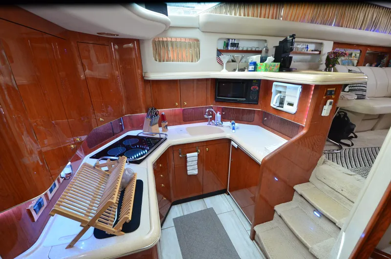 Slide: The Image of Luxurious kitchen interior of 2000 Sea Ray 420 Aft Cabin yacht with modern amenities. - 26