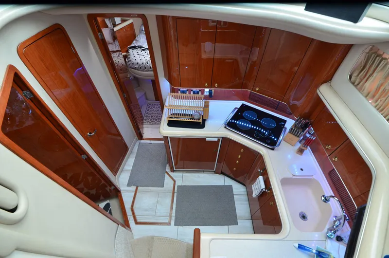 Slide: The Image of Luxurious kitchen interior of 2000 Sea Ray 420 Aft Cabin yacht with modern amenities. - 27