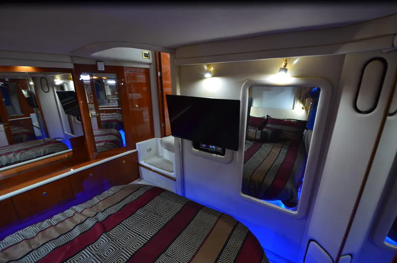 Slide: The Image of Luxurious interior of 2000 Sea Ray 420 Aft Cabin with modern amenities and elegant design. - 33
