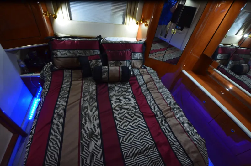 Slide: The Image of Luxurious bedroom interior of 2000 Sea Ray 420 Aft Cabin yacht with elegant bedding. - 34