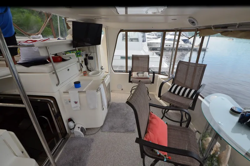 Slide: The Image of Interior of 2000 Sea Ray 420 Aft Cabin yacht with seating and lake view. - 4