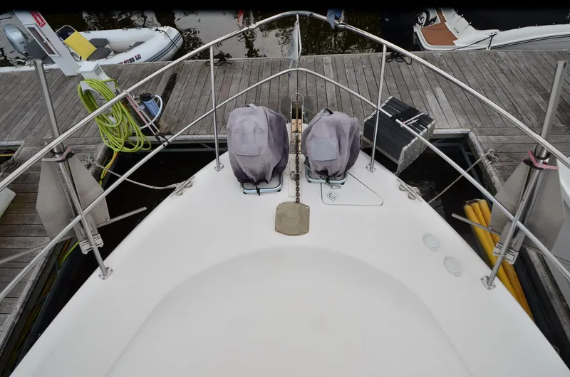 Slide: The Image of Bow view of 2000 Sea Ray 420 Aft Cabin yacht docked at marina. - 42