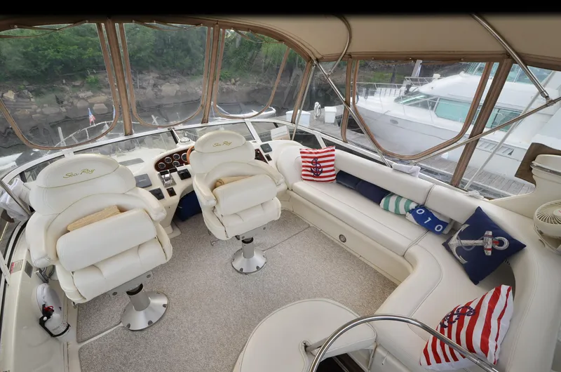 Slide: The Image of Luxurious 2000 Sea Ray 420 Aft Cabin interior with plush seating and nautical-themed decor. - 8