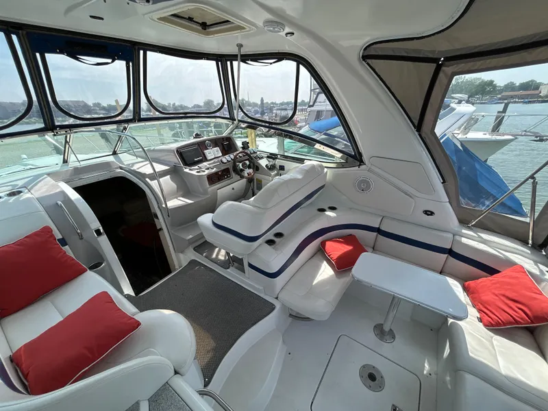 Slide: The Image of Interior of a 2005 Formula 37 PC yacht with white seating and red cushions. - 12