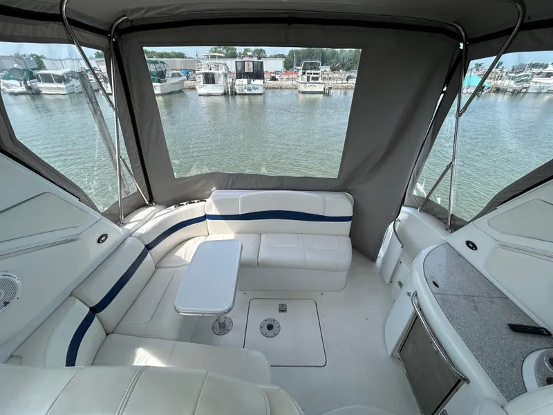 Slide: The Image of 2005 Formula 37 PC yacht interior with seating and table, docked at marina. - 14