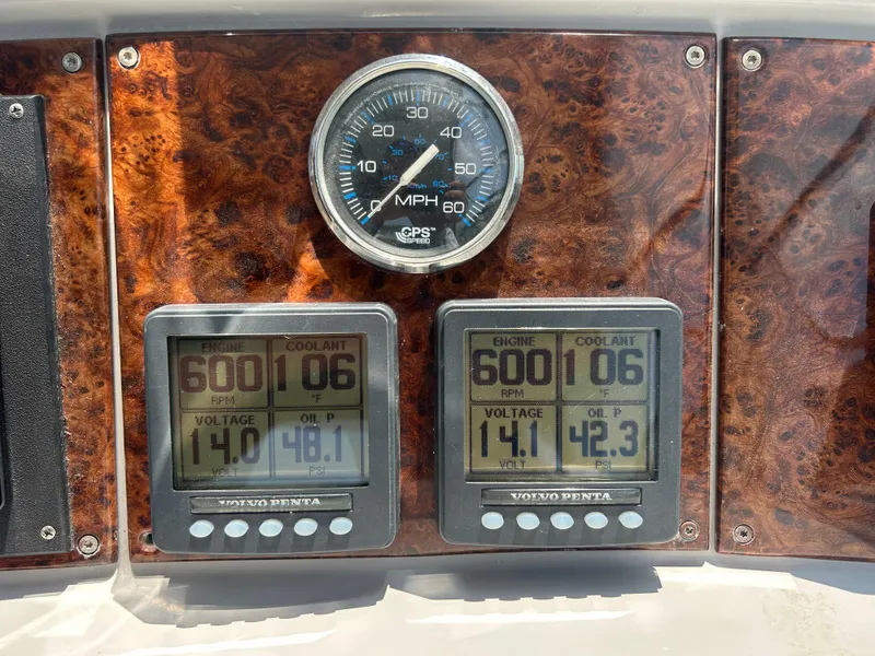 Slide: The Image of Dashboard of a 2005 Formula 37 PC boat with engine gauges and speedometer. - 26