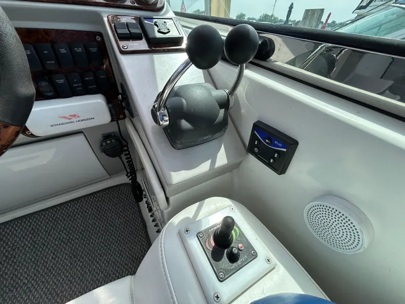 Slide: The Image of Control panel of a 2005 Formula 37 PC boat with throttle and joystick. - 31