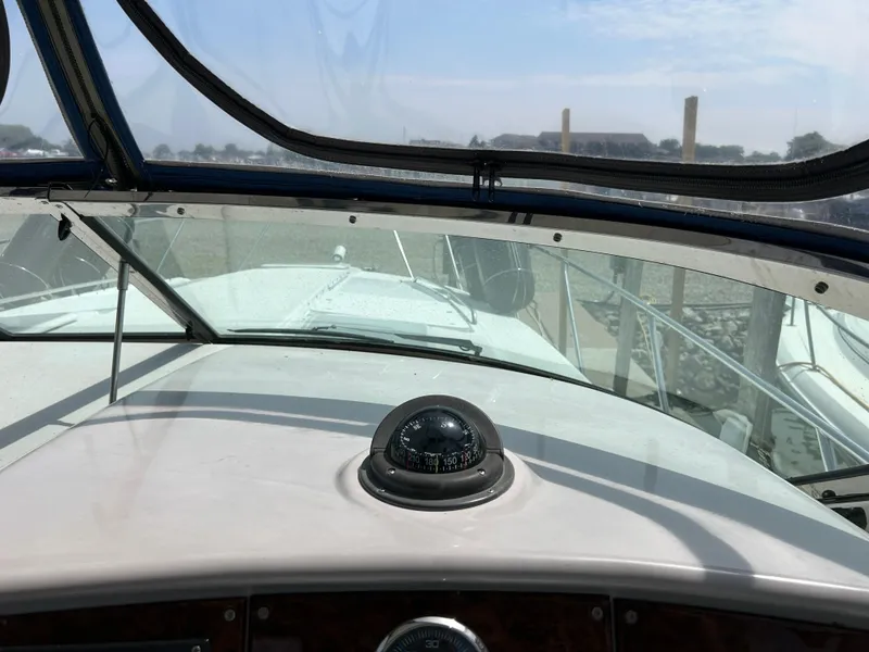 Slide: The Image of 2005 Formula 37 PC boat cockpit with compass and windshield view. - 33