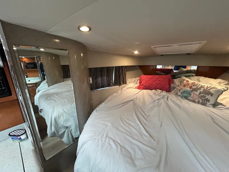 Slide: The Image of Interior of 2005 Formula 37 PC yacht with cozy bed and decorative pillows. - 44