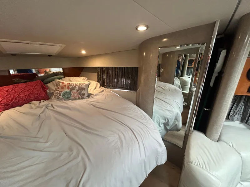 Slide: The Image of Interior of 2005 Formula 37 PC yacht with cozy bed and decorative pillows. - 45