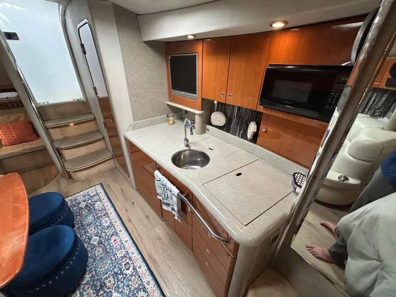 Slide: The Image of Interior of a 2005 Formula 37 PC yacht with modern kitchen amenities. - 46