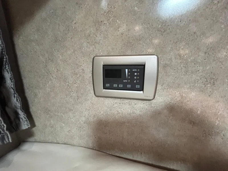 Slide: The Image of Control panel on beige wall inside 2005 Formula 37 PC boat cabin. - 48