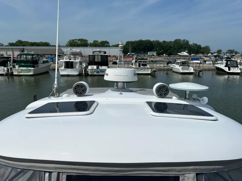 Slide: The Image of 2005 Formula 37 PC yacht docked at marina with other boats in background. - 9