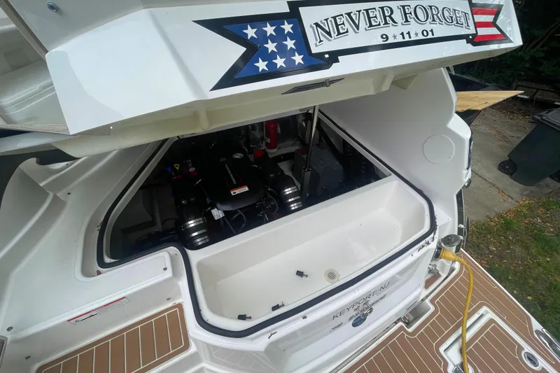 Slide: The Image of 2019 Regal 28 Express boat engine compartment with "Never Forget 9-11-01" decal. - 30