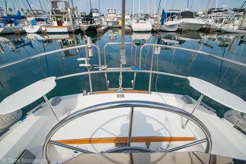 Slide: The Image of Cockpit view of 1988 Catalina 36 sailboat docked in a marina. - 38