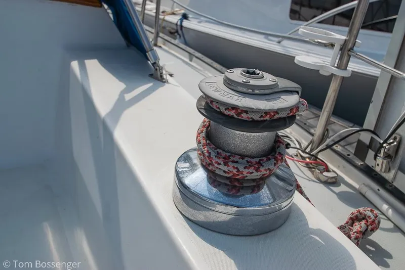 Slide: The Image of Winch with rope on 1988 Catalina 36 sailboat deck, showcasing nautical equipment. - 40